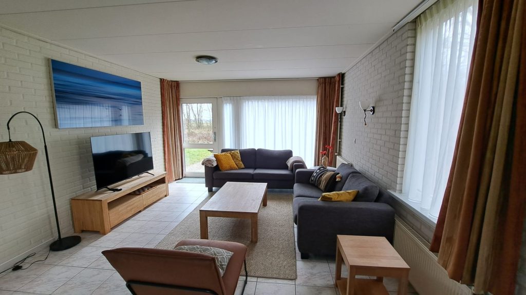 Woonkamer vakantiewoning Meeuw
